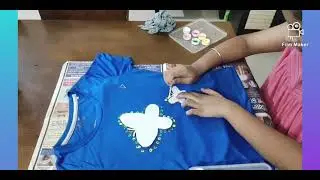 Easy butterfly print on shirt with ear buds and acrylic paint.