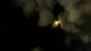 Clouds at night dancing with the Moon