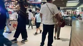 Time-lapse of people in a food market in Bangkok, Thailand.