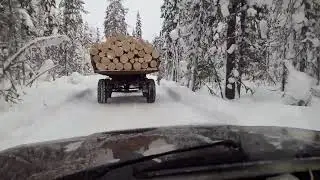 за прицепом