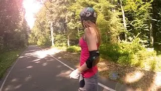 Nataly rides a longboard