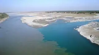 2 rivers meeting but not mixing in urdu