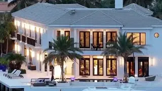 Experience the Ultimate Tropical Paradise Living in this Spectacular Intracoastal Point Lot Home