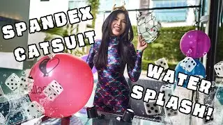 Cute Spandex Model in Catsuit playing a wet Dice Game