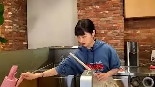 Ryujin struggling with the huge chopsticks