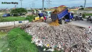 Heavy machinery, Processing Filling Up The Land huge, Bulldozer KOMATSU D31P, Dump Truck unloading