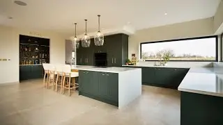 Luxury Redefined: Dark Green Shaker Kitchen with Sliding Walnut Ladder