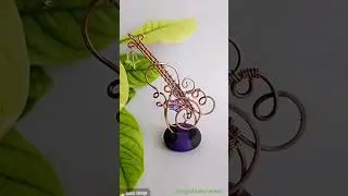 3 Wire Weave Pattern that has been used in making a guitar keychain