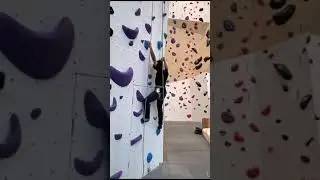 Rock climbing activity in a mall.