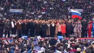 Russian President Vladimir Putin sings the Russian National Anthem.