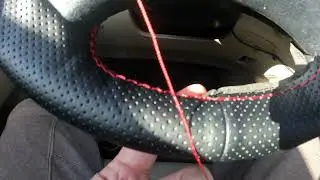 Adding and stitching a steering wheel cover that works for any car.