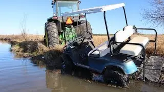 Tractors in mud | Playing in mud on golf cart and we find an abandoned car