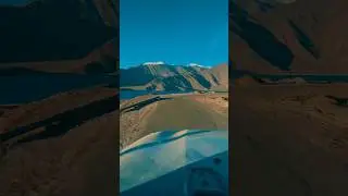 Driving on mountains beside a lake . 