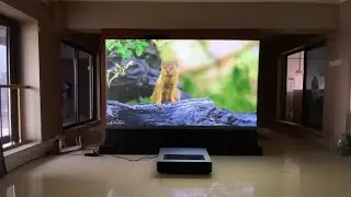 Review of Fengmi 4k MAX 4500 ANSI Lumen Laser Projector on a floor rising projector screen