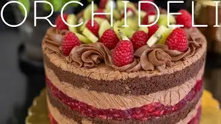 Elegant chocolate cake with raspberries - light, moist, perfect for any occasion.