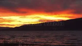 Stock Video - Water rippling on Utah Lake as sky is one fire
