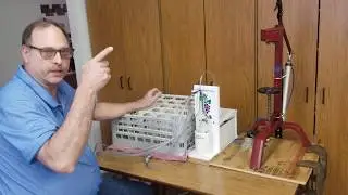 Allinonewinepump to sanitize and bottle while using a homemade pneumatic wine corker machine