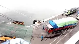 Truck Load in big cargo ship