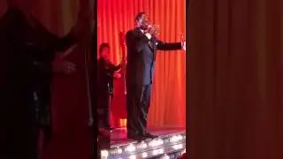 Anthony Brady as Louis Armstrong