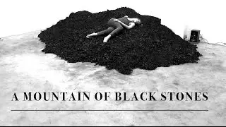 A MOUNTAIN OF BLACK STONES