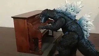 Godzilla ￼playing the piano