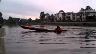 How to empty the kayak of water and then climb in