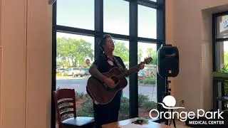Orange Park nurse delights patients with guitar playing