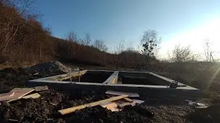 Котлован, обратная засыпка фундамента и закладные под канализацию.