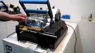 Conical Whisky Bottle Labeling - BenchMAX Labelling Machine