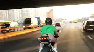 Девушка в стрингах на мотоцикле