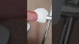 The shower stand without a shower head and hose holder has come loose.