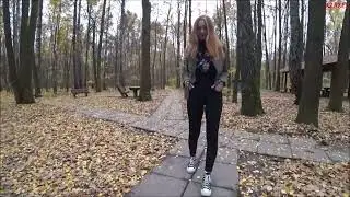 Woman with black converse walks near a group of insects