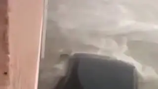 Bahamas Flooding Lifting Car Into Building