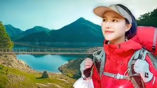 Female Camping. Shall we sleep here tonight? Backpacking while looking at the beautiful lake