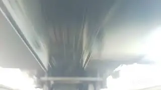 Электропоезд ЭД4М проезжает над камерой.