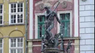 a Bronze Monument of Neptune With a Trident Standing Before a Xviii Century European Monument in a