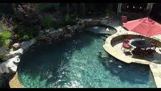 Dual-Level Luxury Pool with Cascading Waterfalls & Naturalistic Design |  Sophisticated Pool Design