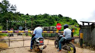 Trains at a Railroad Crossing in India