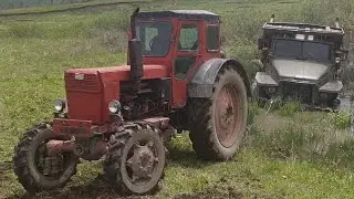 Урал 6х6 застрял на болотах, пришел на помощь Трактор Т 40 4х4