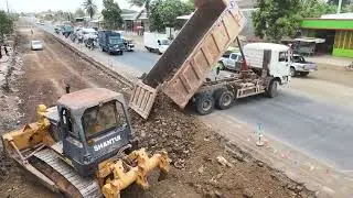 Overall view of road construction by heavy machinery and 25 ton trucks