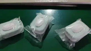 Two layer dishwasher tablet press machine and dishwasher packing machine with water soluble film