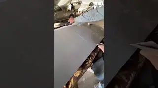 Applying gray putty on door nicely 