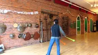Turning with two poi passing in front