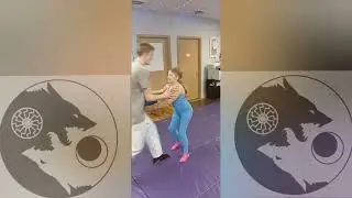 Girls learning jiu jitsu defense.