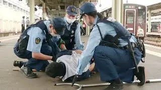 How to deal with a violent incident on a train: Suspicious person response training held at JR To...
