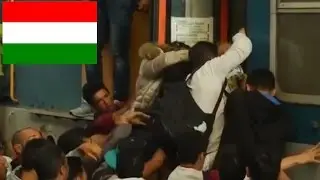 Migrants storm Budapest train