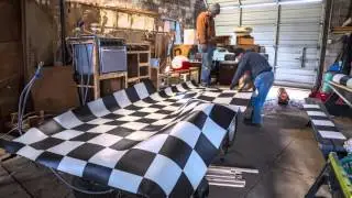 Vinyl checkerboard flooring install on the Toyota Dolphin