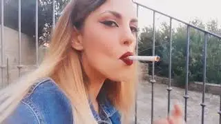 Woman smokes on a piazzetta