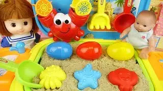 Baby doll sand play bag and surprise eggs toys play