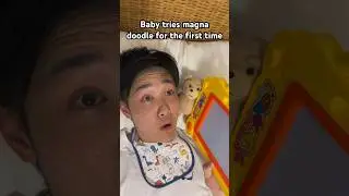 Baby tries the magna doodle for the first time